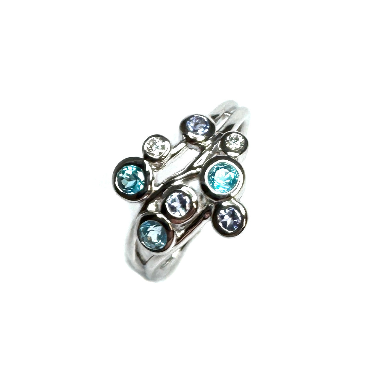 9ct White Gold Blue Topaz, Tanzanite And Diamond Ring